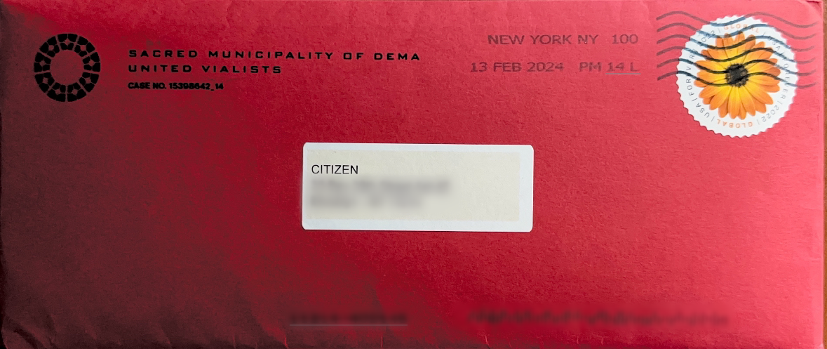 Alt text: Photo of the front of a red envelope mailed to the fans.